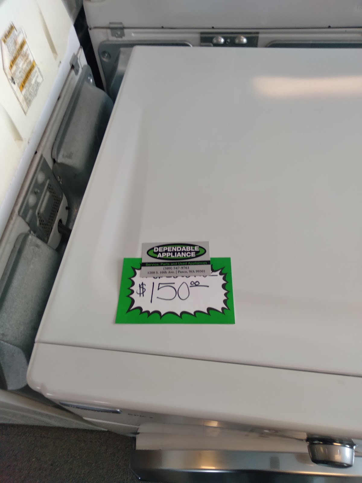 A Dependable Appliance price tag with the shop logo, phone number and Pasco address